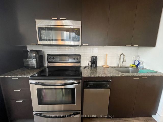 2004 - 23 Sheppard Ave E
