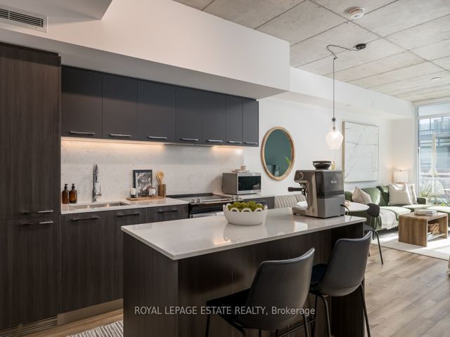 408 - 665 Queen St E