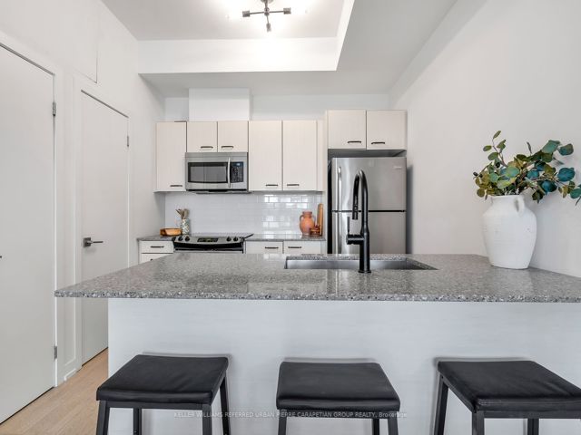 3 - 1331 Gerrard Ave E
