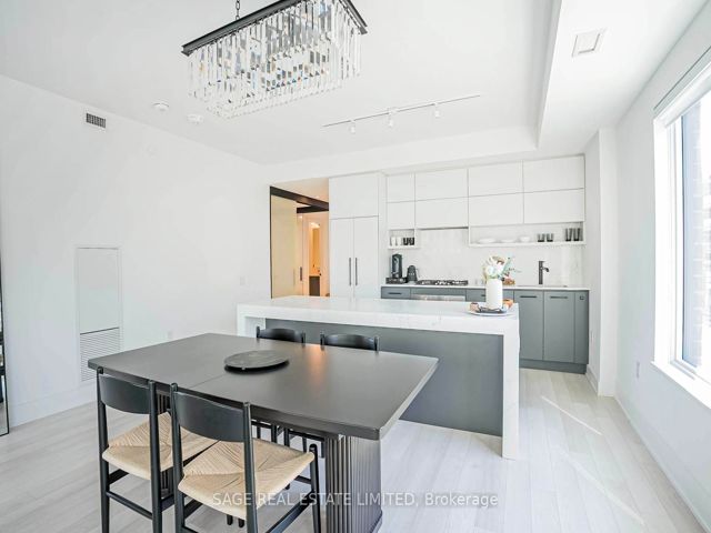 206 - 1888 Queen St E