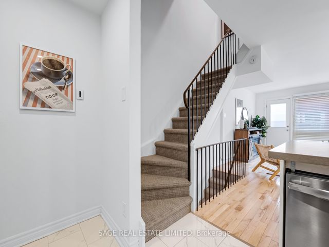 38 - 1209 Queen St E