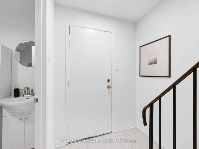38 - 1209 Queen St E