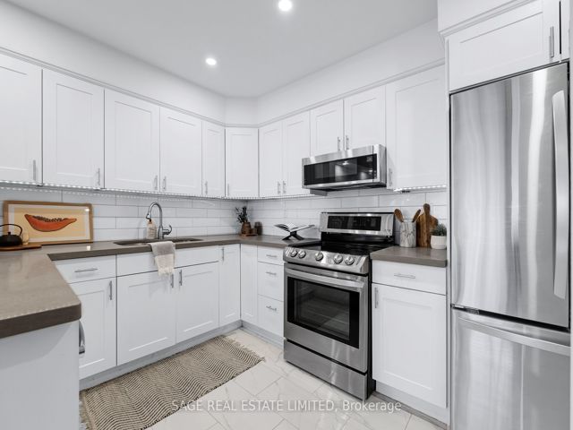 38 - 1209 Queen St E