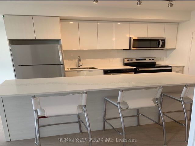 305 - 859 The Queensway Blvd W